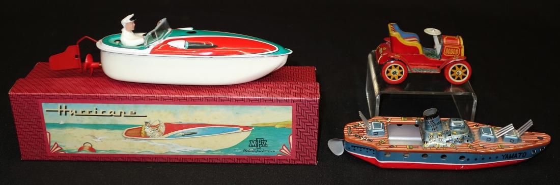 TIN BOATS & CAR (3) PCS.: Litho tin; (1) Yamato battleship, Japan, putt putt; (1) old timer car, Japan, friction; (1) Hurricane speedboat, West German, mechanical, working, original box; L-3 1/2" - 7 1/2", G-EX