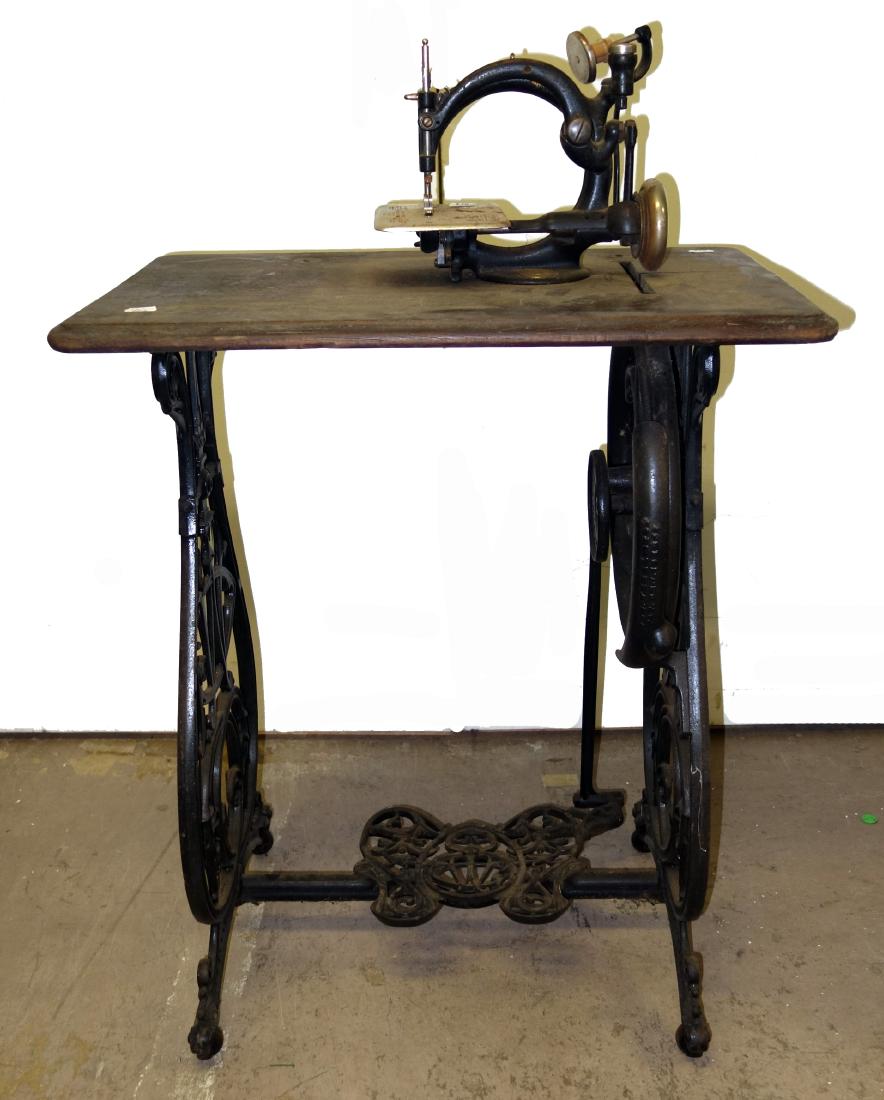 WILCOX & GIBBS SEWING MACHINE: Ornate cast metal base; some surface rust; H-36", L-25", F-G