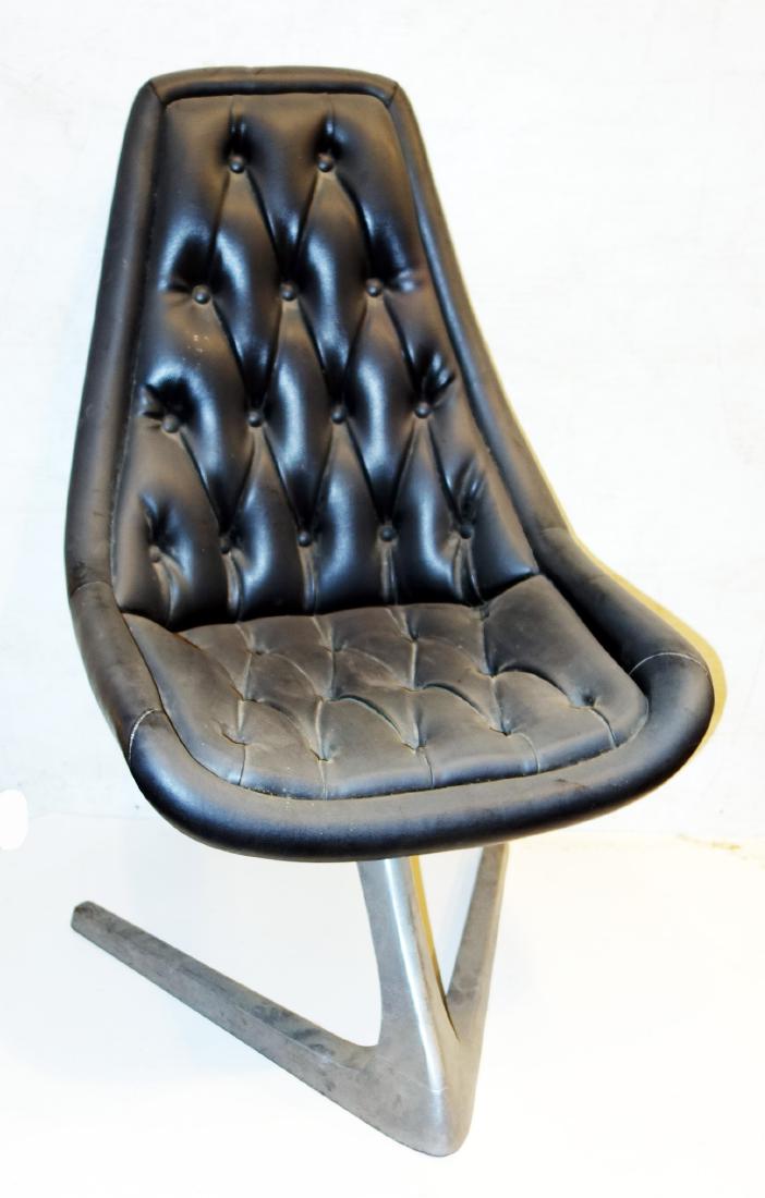 MODERN CHAIR: Black vinyl with "V" shape chrome base; normal wear; needs cleaning, some mold but wipes off easily; (1) small pit in upholstery near top/front and a few scuffs; H-37", G