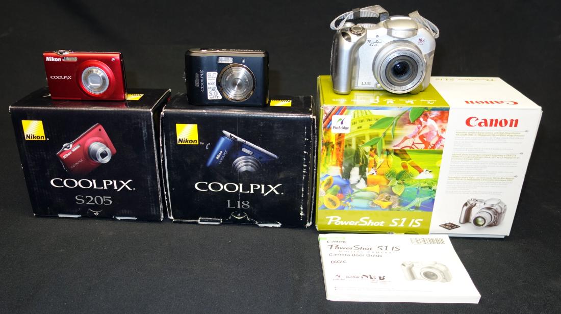 NIKON & CANON CAMERAS (3): With boxes, some instructions; (1) Cool Pix L-18; (1) Cool Pix S205; (1) Powershot S1 IS; VG