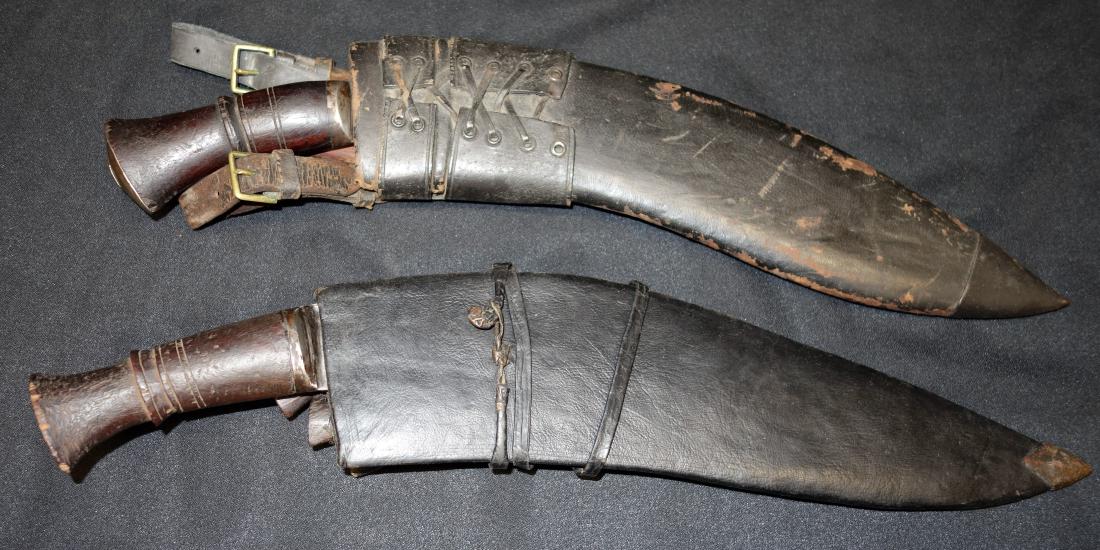 GURKHA KNIVES with SHEATHS (2): (1) WWI Bhojpure Nepal, scabbard with two smaller knives, 1917- saw service; (1) sheath with one smaller knife, late WWII, Indian Army; blades L-13"