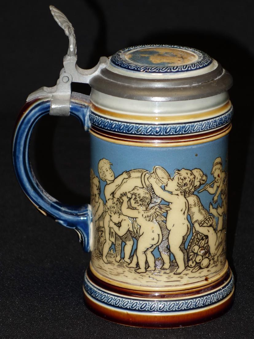 METTLACH STEIN (3/10 L): Incised classical scene with cherubs and inlaid top; #2025; H- 6 1/2"; EX-VG