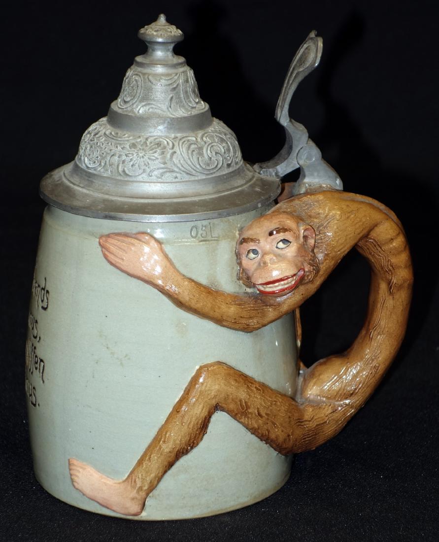 MONKEY CHARACTER HANDLE STEIN (1/2 L): Germany; full body monkey handle; verse on front; pewter lid; #1596; some interior crazing; H- 7"; VG