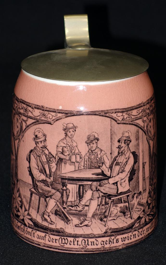 SARREGUEMINES STEIN (.5 L): Pink ceramic with transfer tavern and mountain sheep scenes; Hogo Pohl metal lid; interior crazing; H- 5 1/2"; V-G