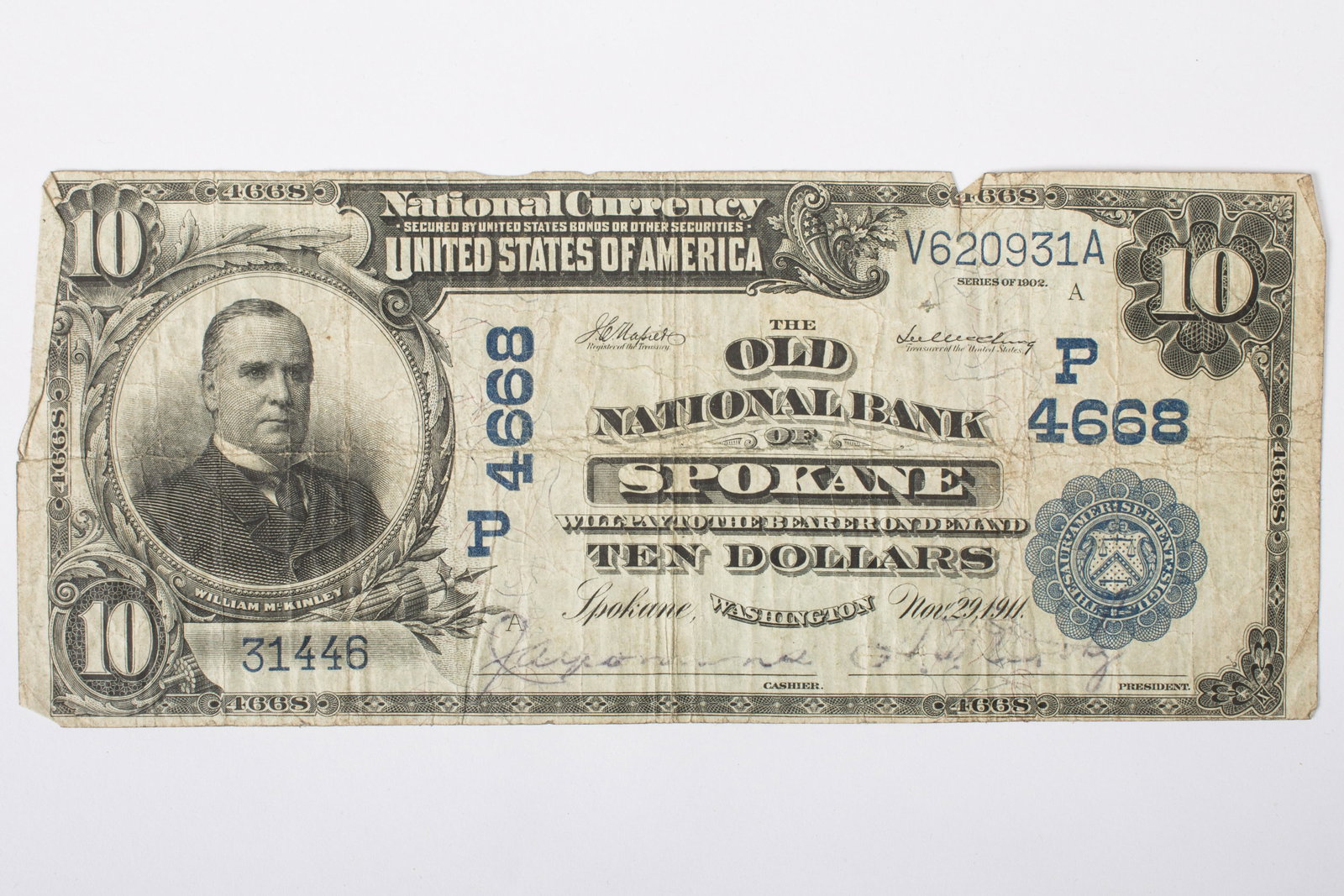 1902 $10 NATIONAL CURRENCY SPOKANE WA: P4668, V620931A-31446 A; vertical & horizontal folds; small losses in top edge, corner and edge folds; creasing; VG