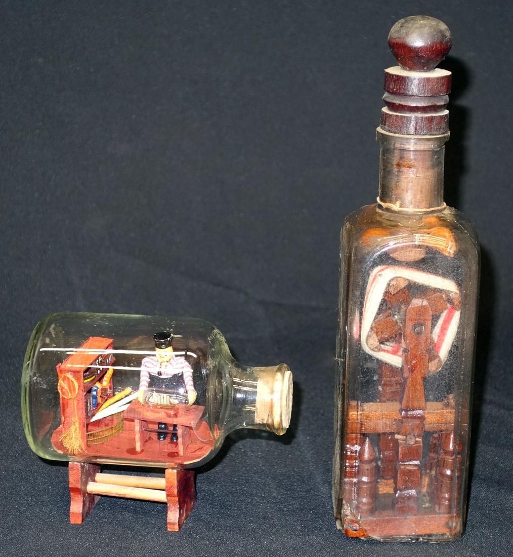 FOLK ART IN A BOTTLE (2): Painted wood and glass; (1) ship builder in a bottle; (1) yarn winder, tramp art style, bottom of bottle broken; H-4 1/2" - 11", G-VG