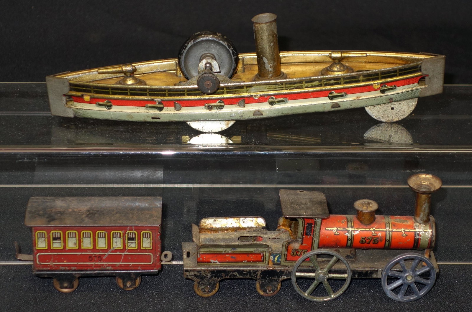 GERMAN TOY TRAIN & BOAT: Litho tin; (1) train #575, mechanical, working; wear and loss; (1) gunboat - flywheel, normal wear; L-9 1/2", F-G