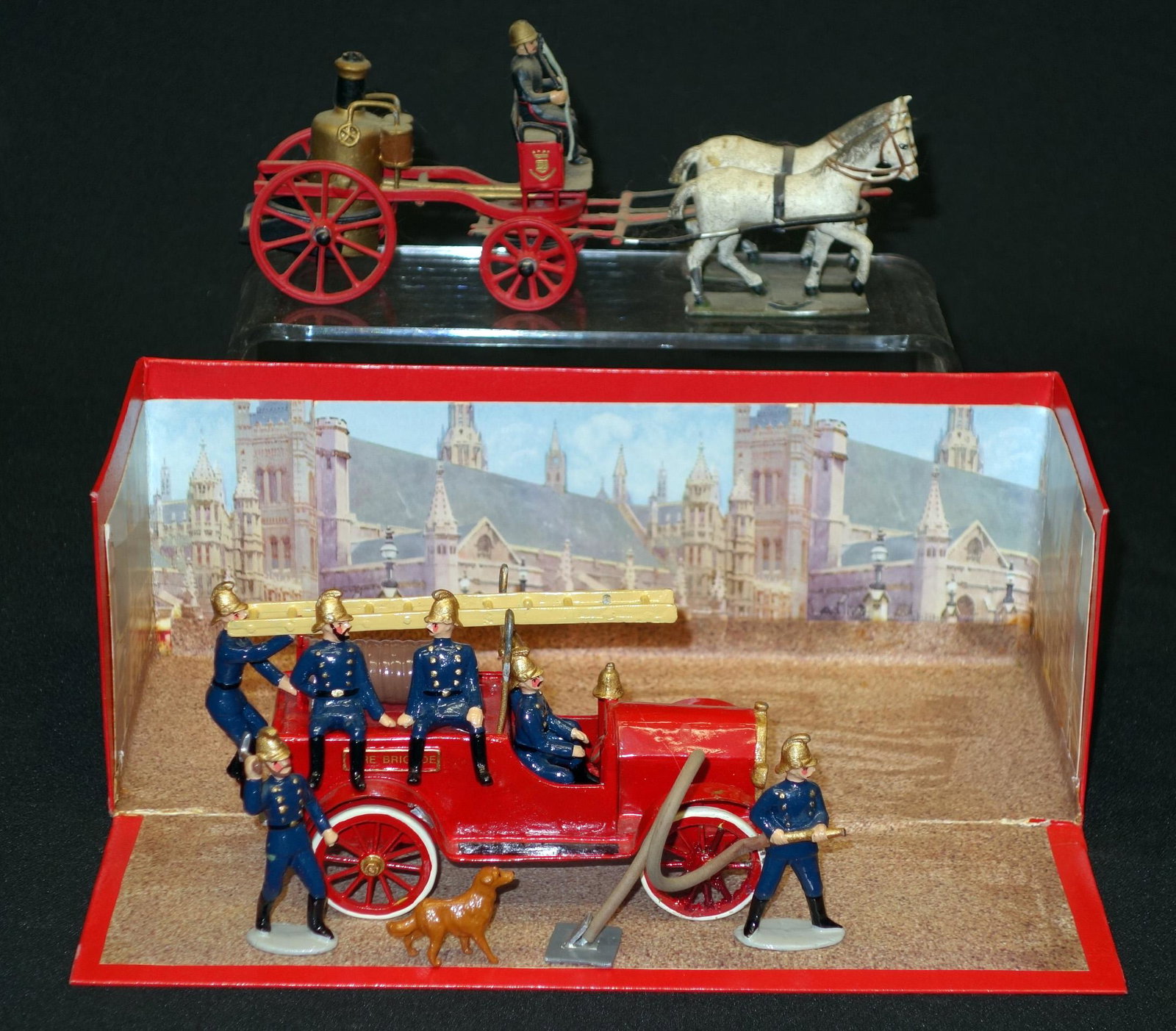 DIECAST FIRE TOYS (2): Painted metal; (1) automotive: contemporary, extra figures and diorama box; (1) horse-drawn: pumper, vintage; ear loss and possibly missing (1) figure; L-5"-7", G-VG