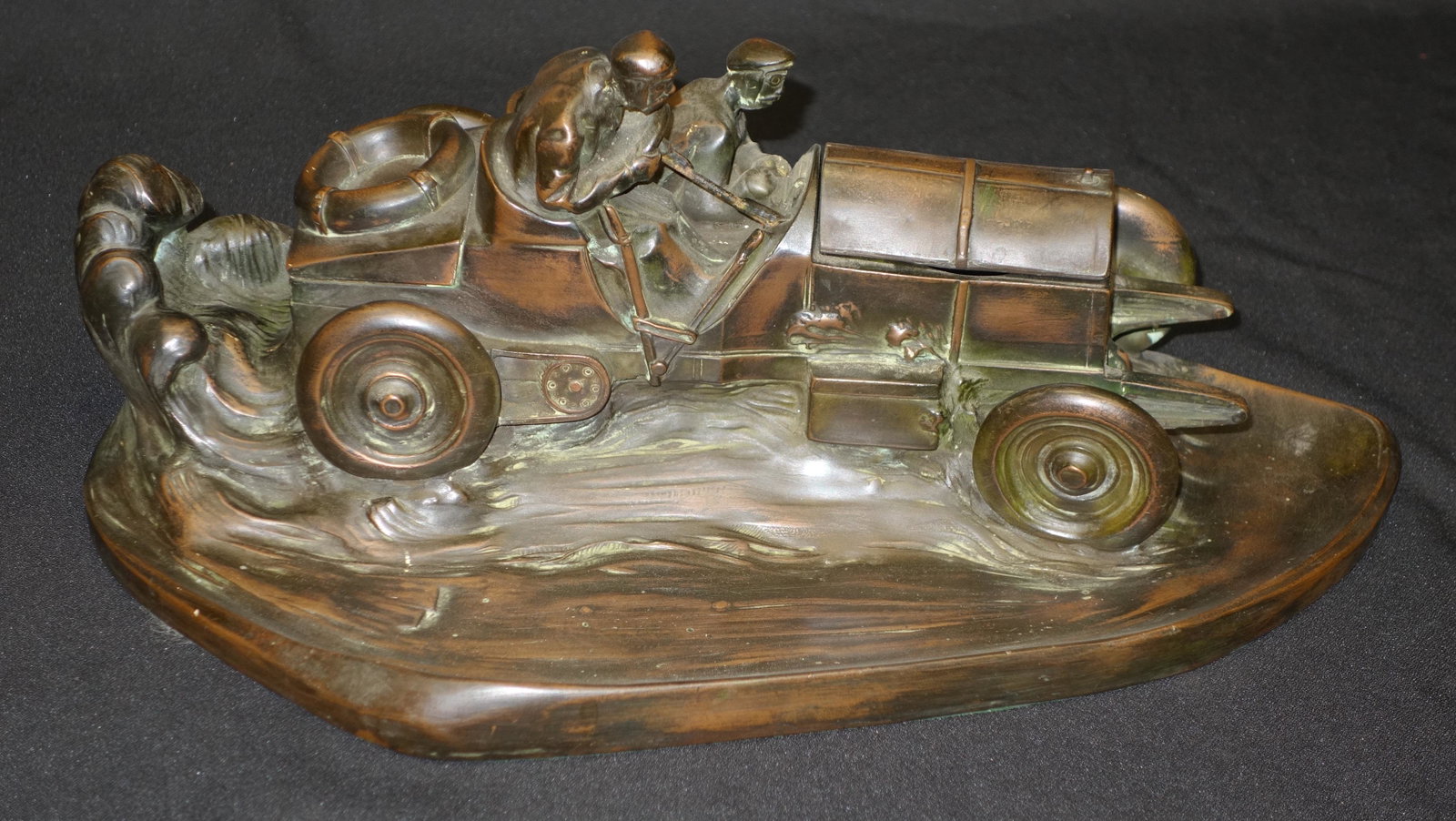 RACE CAR INKWELL SCULPTURE: Cased copper and filled bronze style desk item; signed Frick (?); hood opens to reveal inkwell which is missing; original patination; L-15", VG-EX
