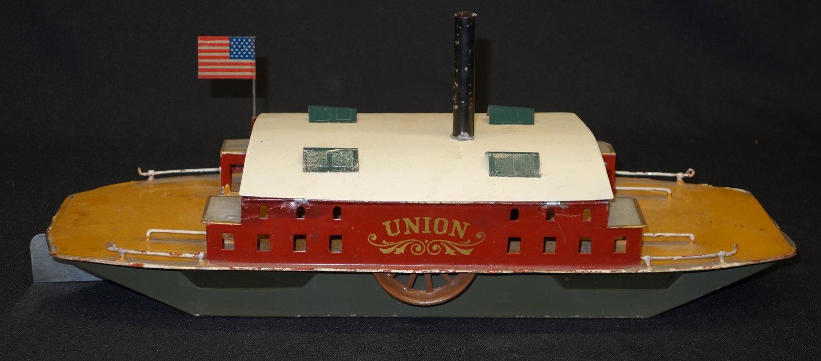 "UNION" TOY FERRY BOAT: Painted tin; mechanical but replaced roof covers mechanism, so not tested; bottom half of boat appears original; L-15", G