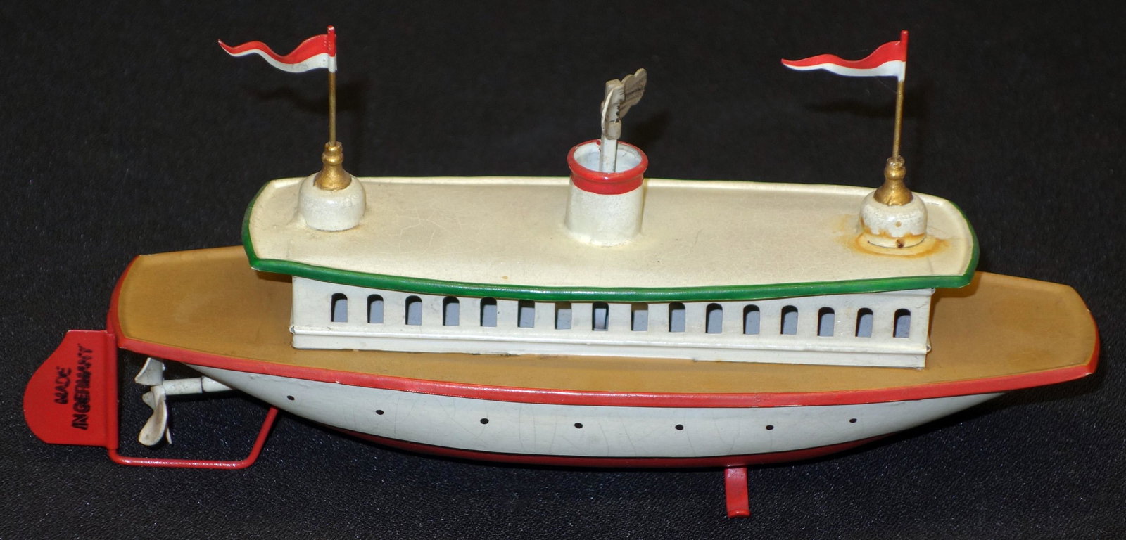GERMAN TOY FERRY BOAT: Painted tin; mechanical; working; 1910's-1930's?; rudder stamped "Made in Germany"; L-8", EX-NM