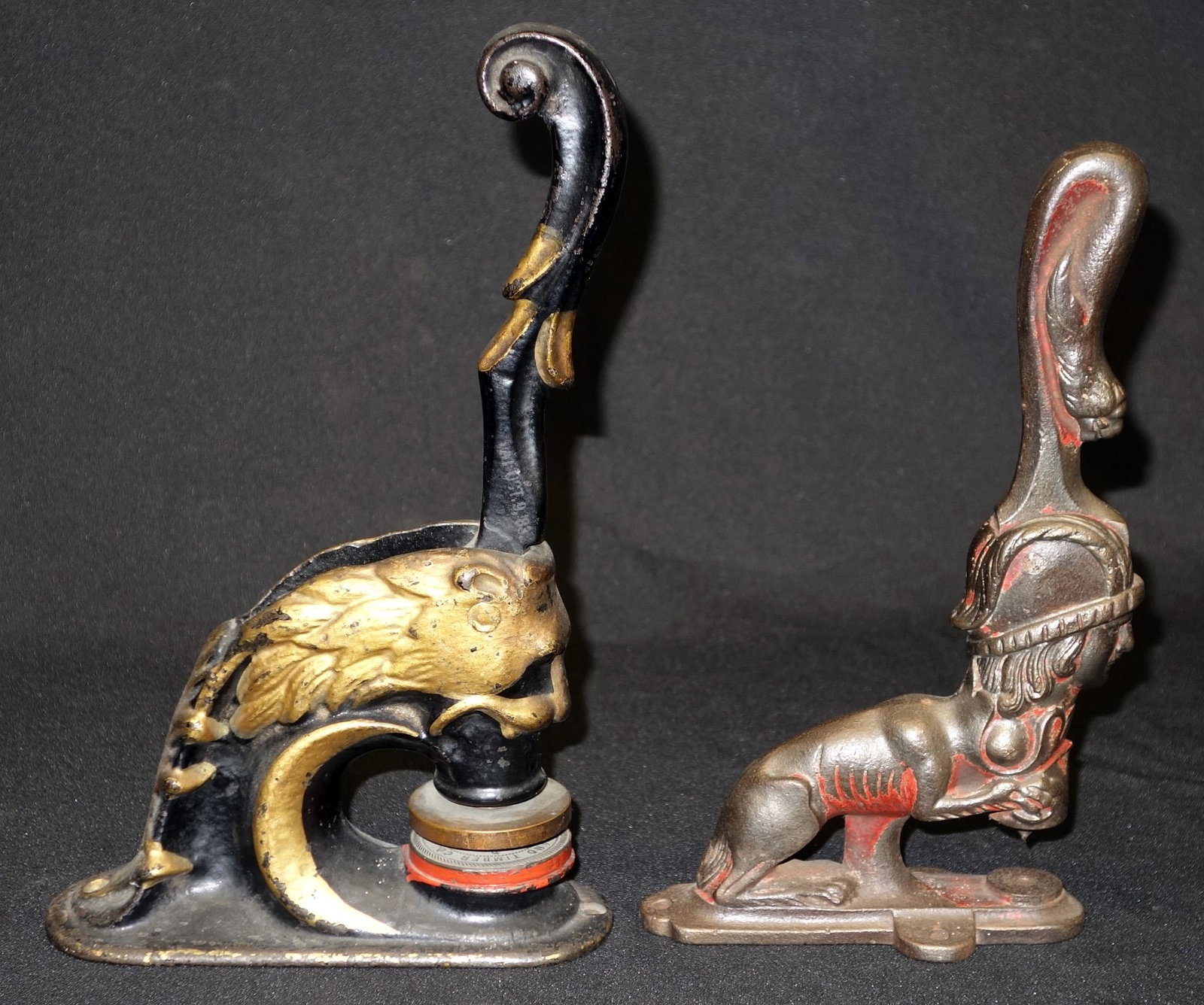 NOTARY SEAL & PUNCH (2) PCS.: Cast iron; (1) punch: mythological lion with man's head and lion head handle; (1) seal - lion form; good paint; H-9 1/2" - 11", G-VG
