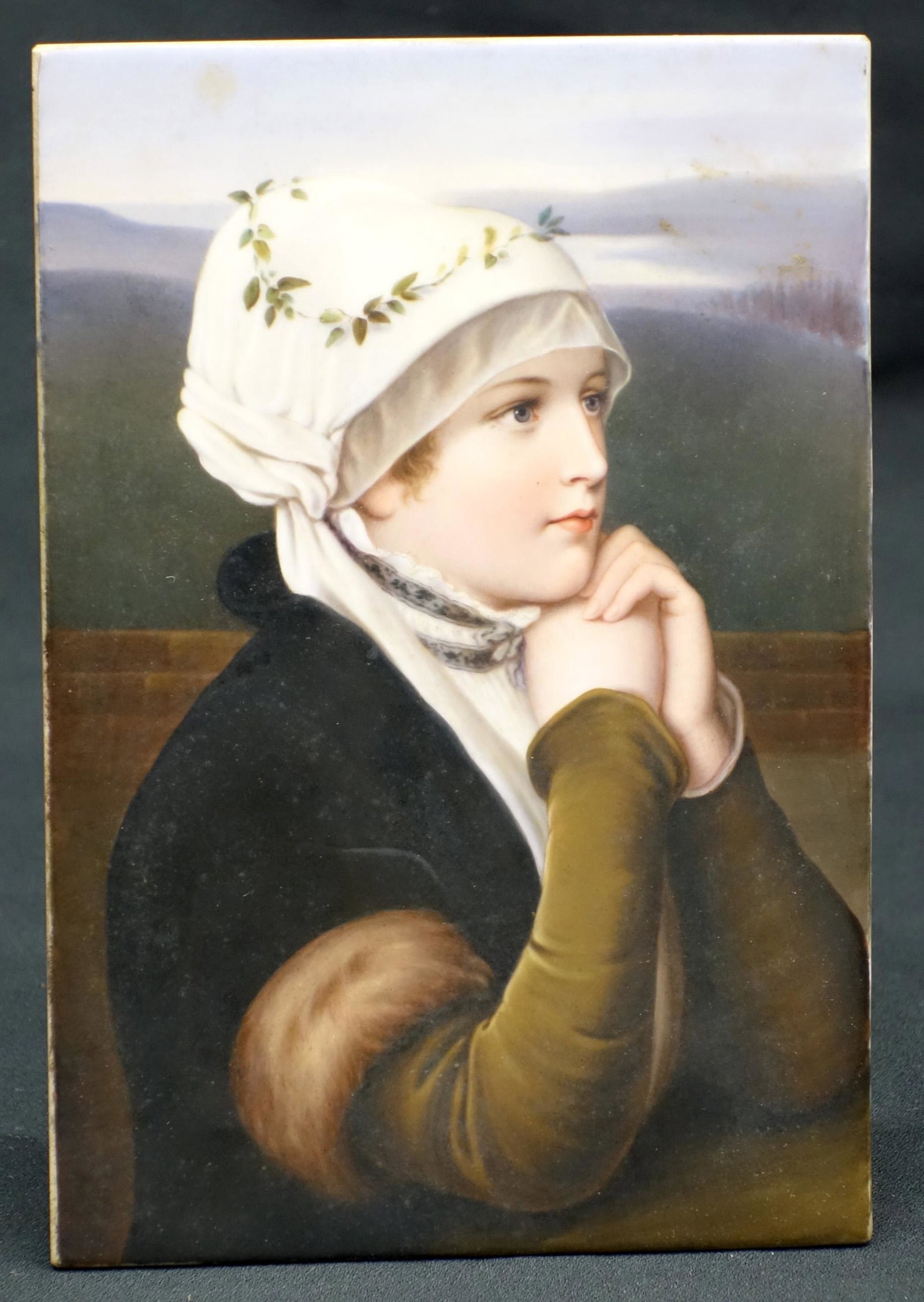 KPM PLAQUE: Im Gebet (?); painted porcelain; young woman with bonnet; impressed KPM mark; some fading; 8 1/2" x 5 1/2", G