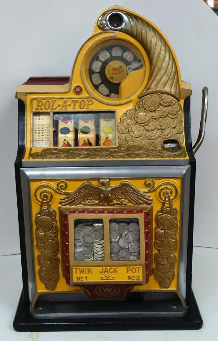 "ROLL-A-TOP" SLOT MACHINE: 25 Cents; painted cast metal and wood case; works; nromal wear; H-27", VG-EX