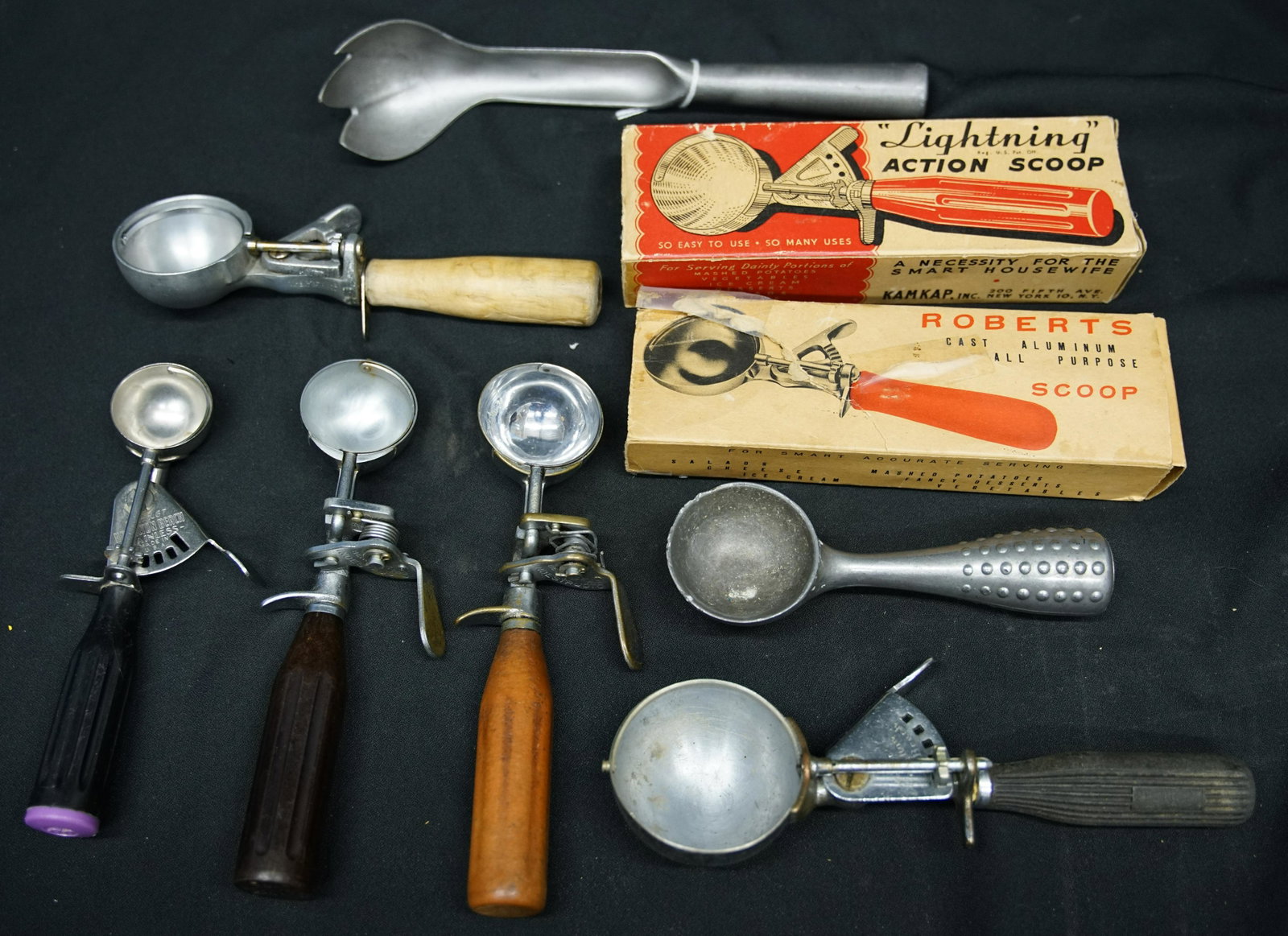 ICE CREAM SCOOPS (9): Metal with wood, bakelite, & metal handles; (1) "Lightning", original box, rough; (1) "Roberts", original box, rough; (2) "Hamilton Beach" model #67 and #160B; (2) "Indestructo", #24 and Delux; (1) Pr