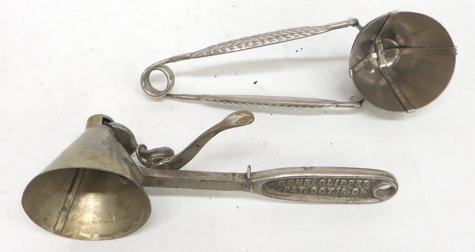 CONICAL ICE CREAM SCOOPS (2): Nickel plated; (1) Kingery, #10; (1) Geer, "Cone Clipper", #10; normal wear; L-9"; G-VG
