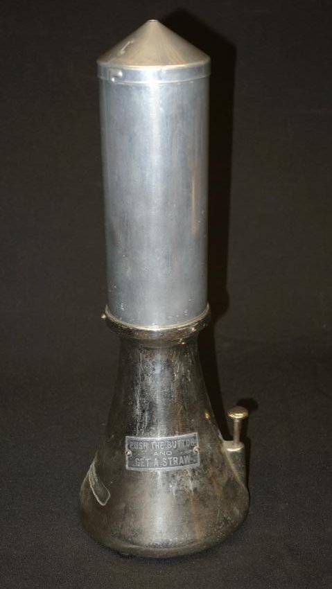 SANISTRAW DISPENSER: Rocket ship form; nickel-plate; "Push the Button and Get A Straw"; scratches and wear; H-17"; G-VG