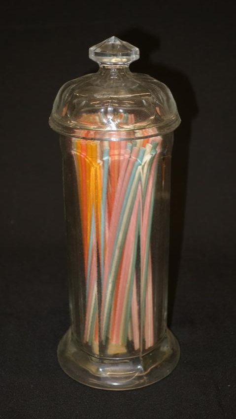 SODA FOUNTAIN STRAW HOLDER: Clear paneled glass; "Colonial" pattern; octagonal knob finial; normal wear; H-12 1/2"; G-VG