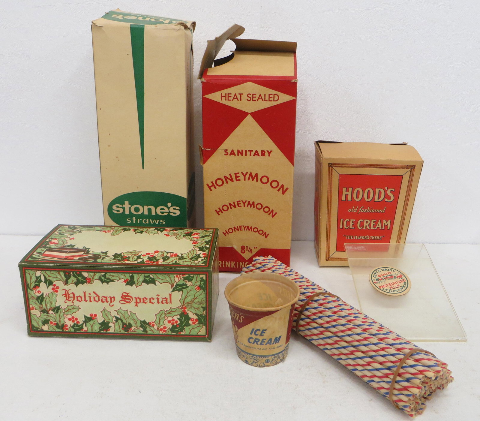 SODA FOUNTAIN PAPER PRODUCTS: Paper and cardboard litho - (1) "Honeymoon" straw box, with some straws; (1) "Stone's" straw box - almost complete; (1) group of red, white and blue straws; (1) "Hood's" ice cream box; (1) "Bordens" s