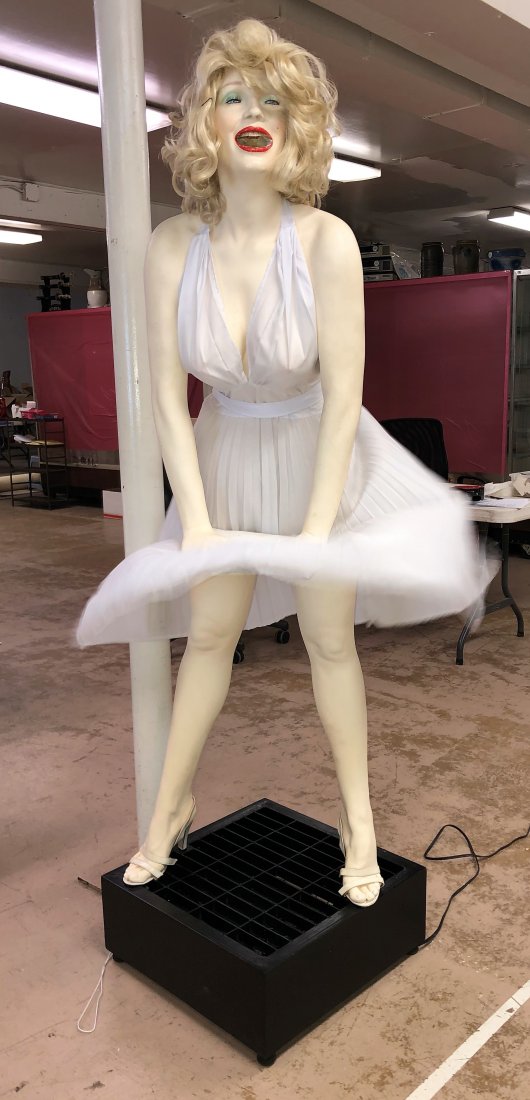 MARILYN MONROE DISPLAY: Painted composition with fabric dress, real clutch and shoes; mechanical fan blows dress; lower teeth loose from jaw and need to be stabilized; H-73"