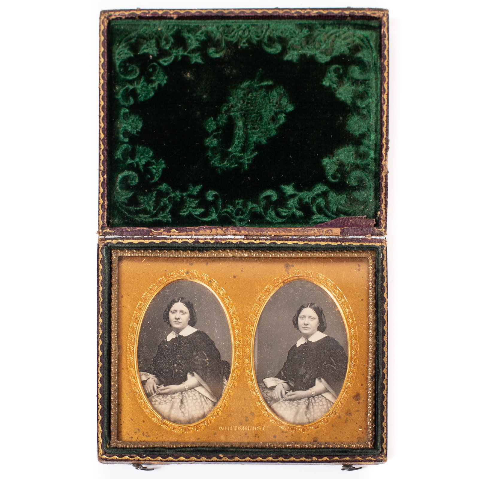 WHITEHURST STEREO DAGUERREOTYPE: Image of lady in cape, wearing brooch and bracelets; pressed leather case with urn of flowers; gilt mat; image H-2 3/8"; case wear, case G-VG; image EX