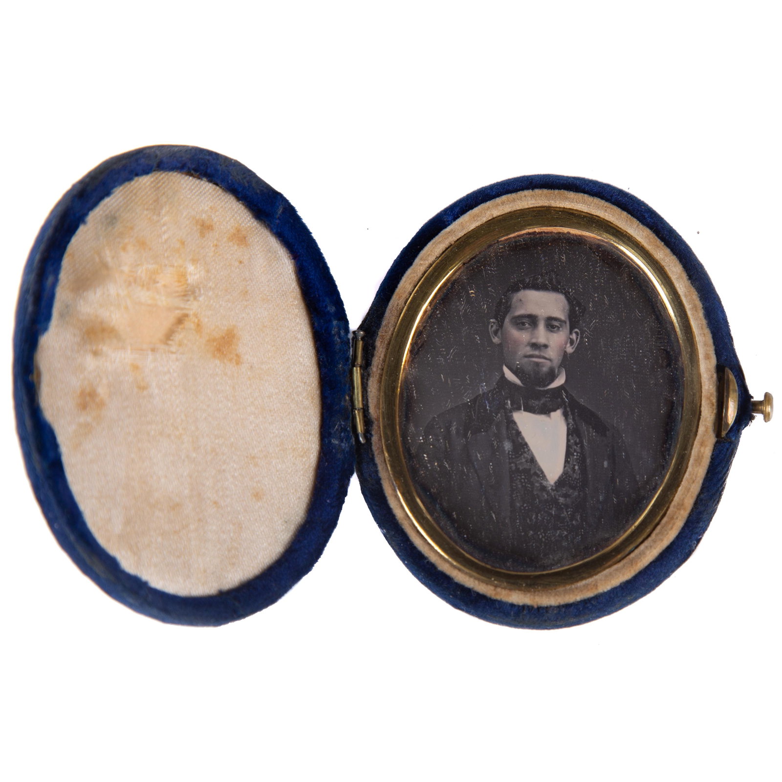 DAGUERREOTYPE YOUNG MAN PORTRAIT: Image of young man with goatee and vest; simple gilt mat; velvet oval case, locking case; image H-2", case H-2 1/2", G-VG