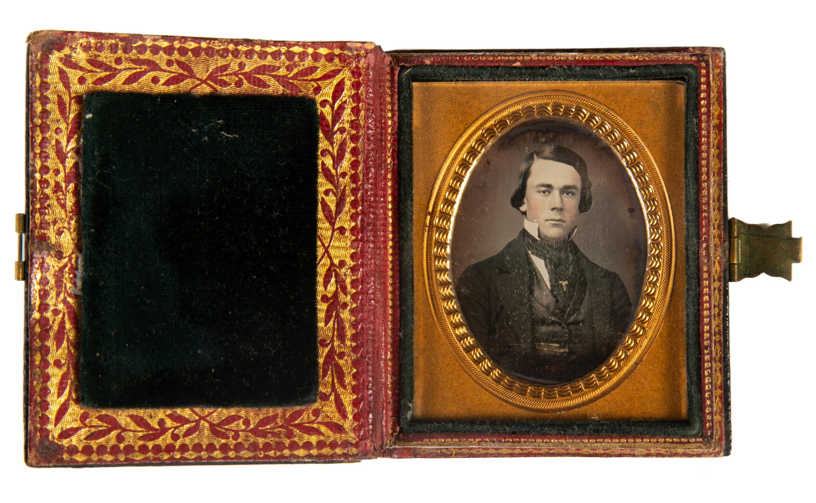 DAGUERREOTYPE PORTRAIT OF GENTLEMAN: 9th plate image of well dressed young gentleman with ascot; gilt mat; lacquerware case with mother of pearl; case crazed; case 3" x 2 1/2", VG-EX