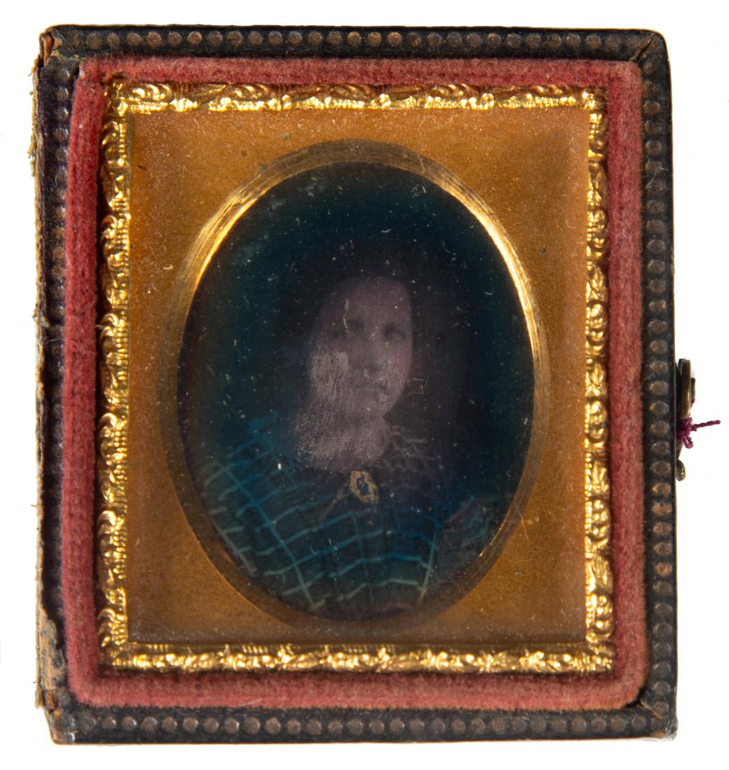 PORTRAIT TINTYPE: 16th plate, image of young woman with brooch; half metal mat; half stamped leather case; dark; F