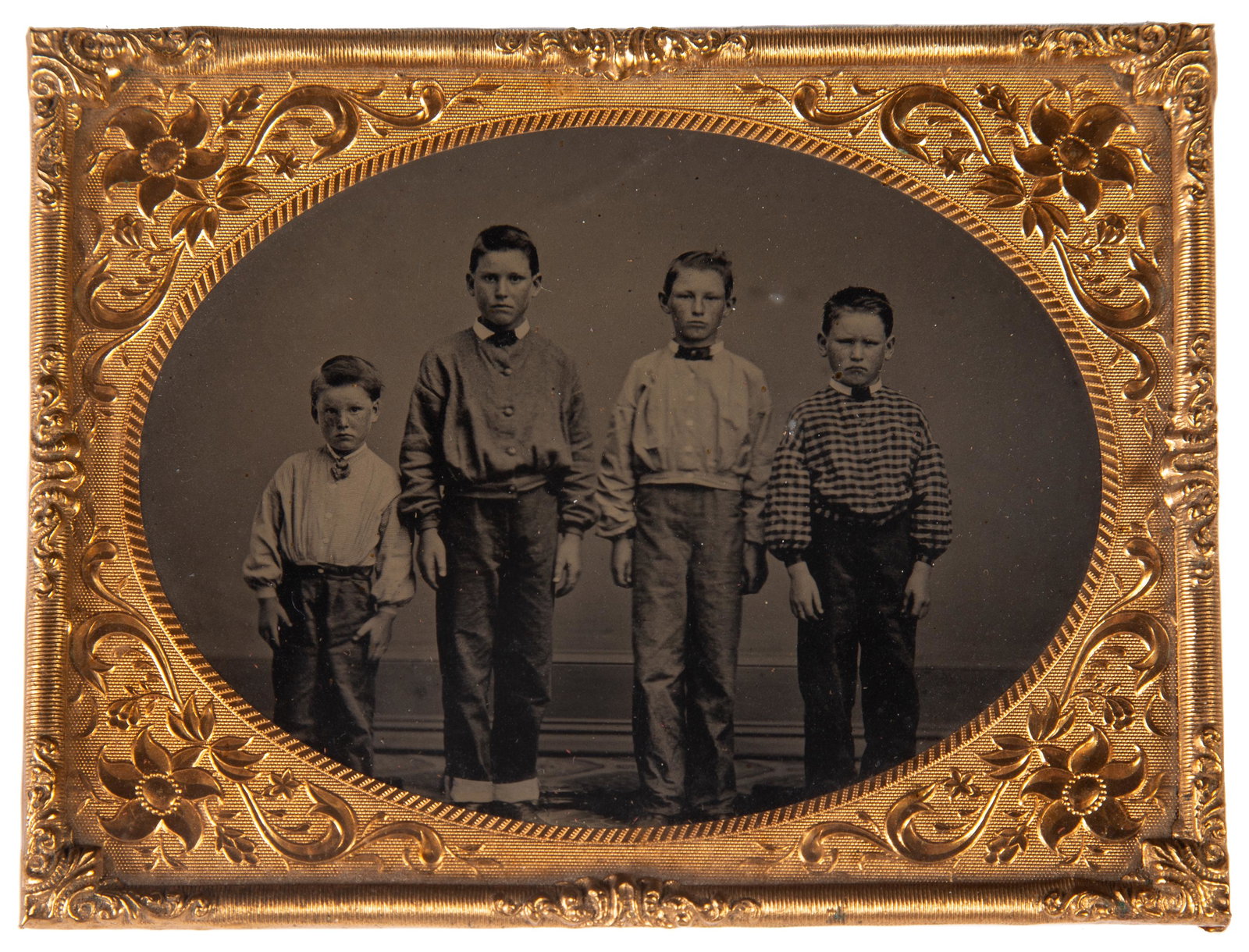 AMBROTYPE OF BOYS: Quarter plate of four boys wearing collars; gilt metal mat; VG-EX
