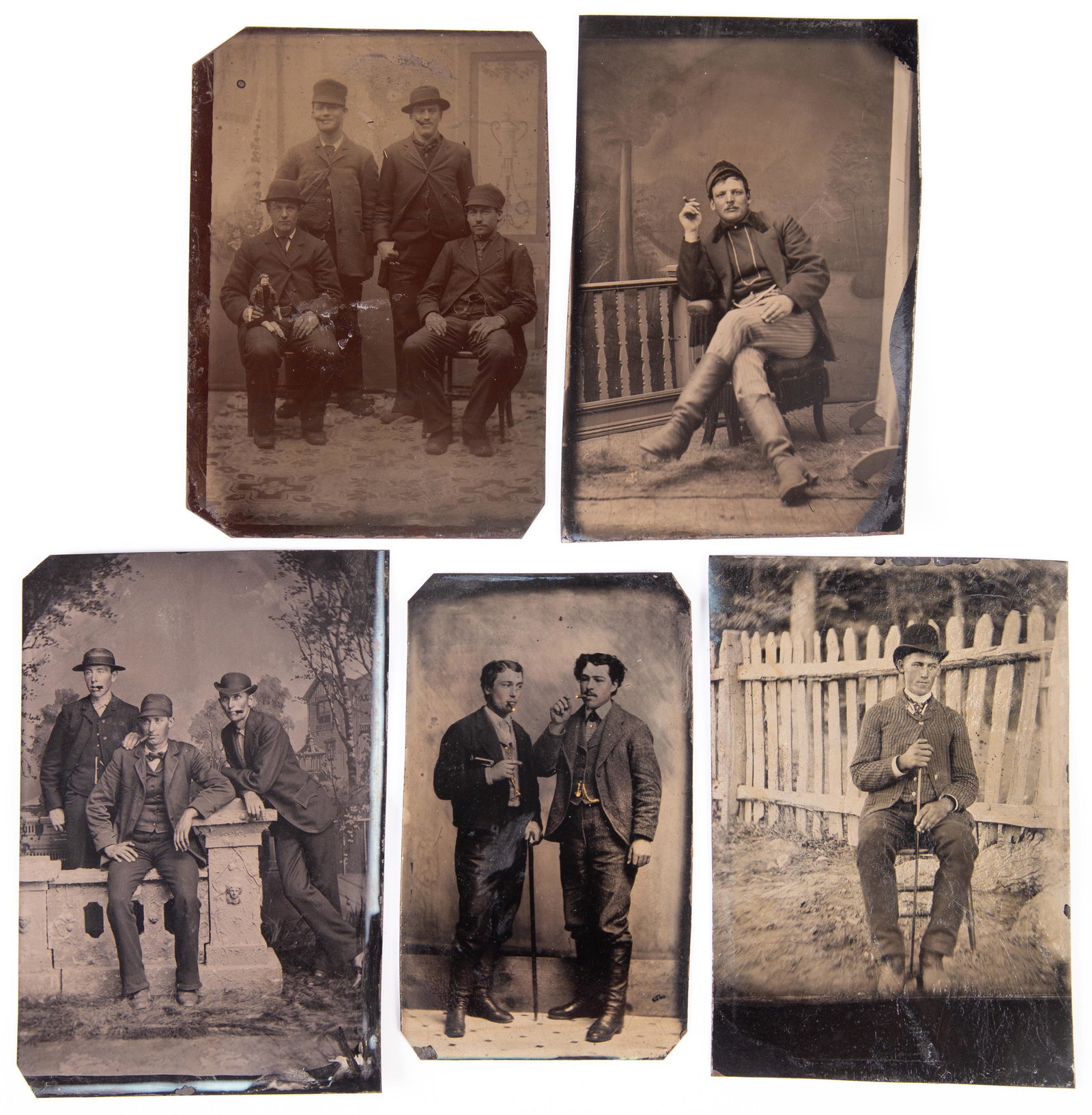 TINTYPES OF MEN SMOKING (5): 6th plates; (1) man holding cane; (1) man holding doll; no mats; no cases; some darker; normal wear; VG-EX