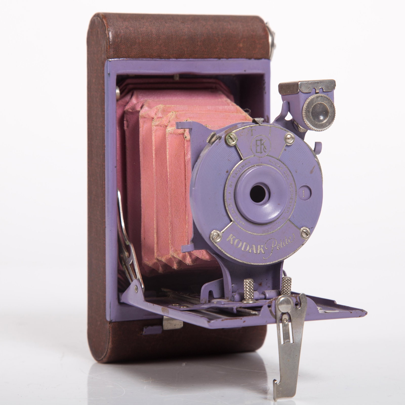 RARE AUTOGRAPHIC KODAK PETITE CAMERA: Folding; purple on purple front; small holes in bellows; wear; L-5", G