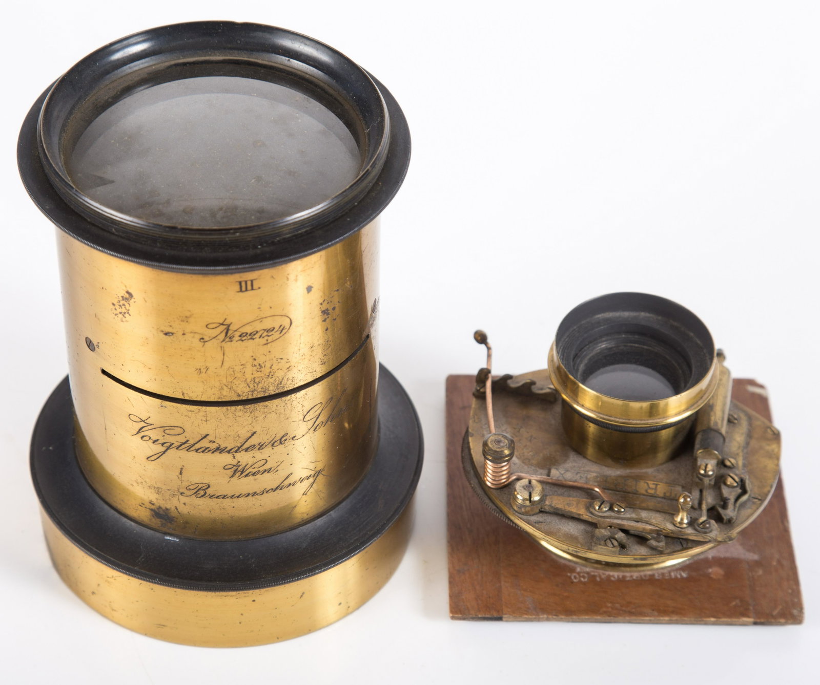 PHOTOGRAPHIC LENS (2): (1) Brass Voightlander lens #22724; (1) Prosch Triplex sutter/lens, missing stop; normal wear; L-3"-5 3/4", G-VG
