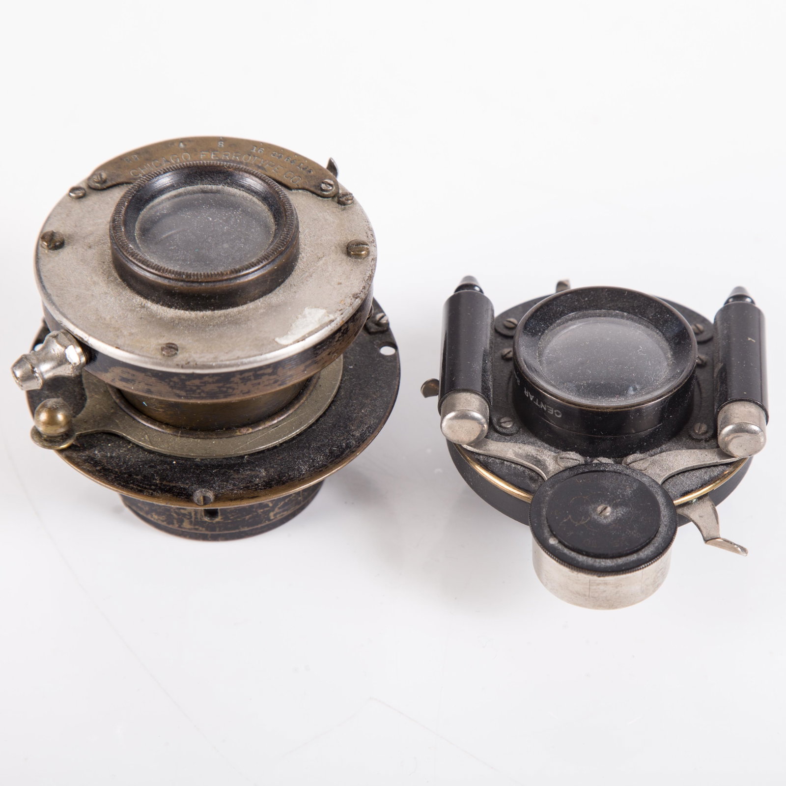 PHOTOGRAPHIC LENS (2): (1) Chicago Ferrotype; (1) Kodak Century Camera Co, wear; L-1 1/4" - 2 1/4", G