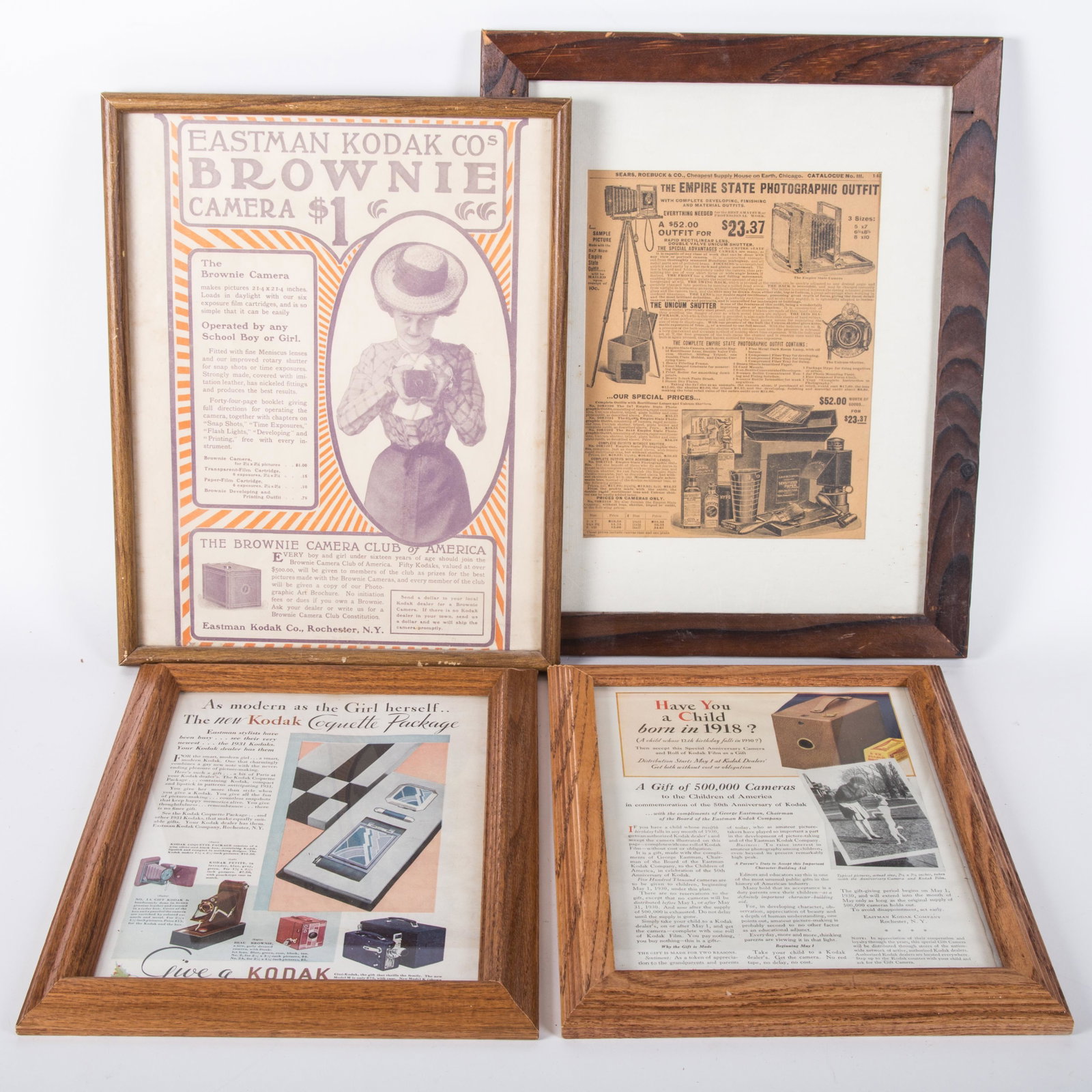 PHOTOGRAPHIC ADVERTISING (4): (3) Kodak Magazine ads, (1) Empire State Photographic outfit; all framed; largest frame 13" x 16", G-VG