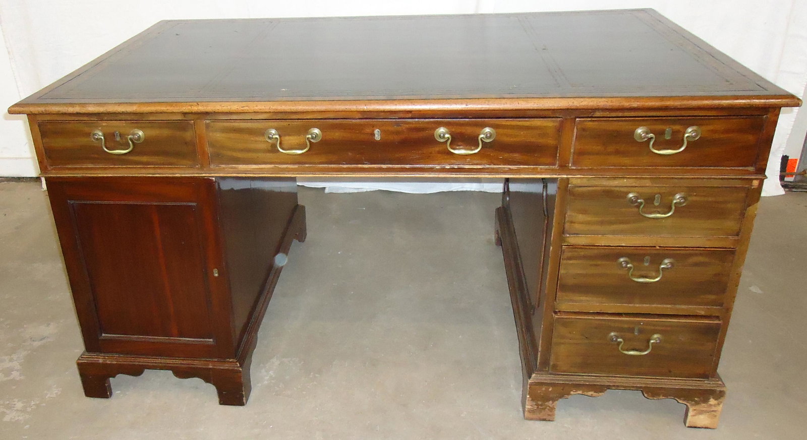 GEORGIAN PARTNERS DESK: Mahogany; double pedestal; three drawers on either side; leather inset top; some finish loss and normal wear; L-60", Depth-38", G