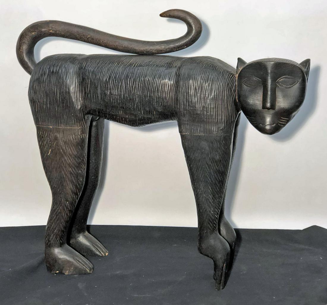 CARVED MONKEY SCULPTURE: Carved and stained wood; normal wear; H-24", L-26", G-VG