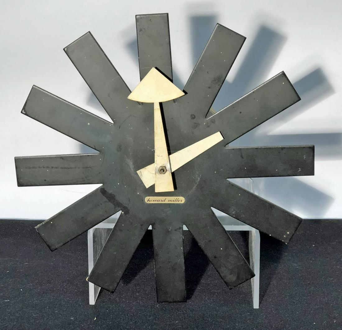 HOWARD MILLER ASTERISK CLOCK: Painted metal; #02213; untested; some wall paint residue; H-10", G