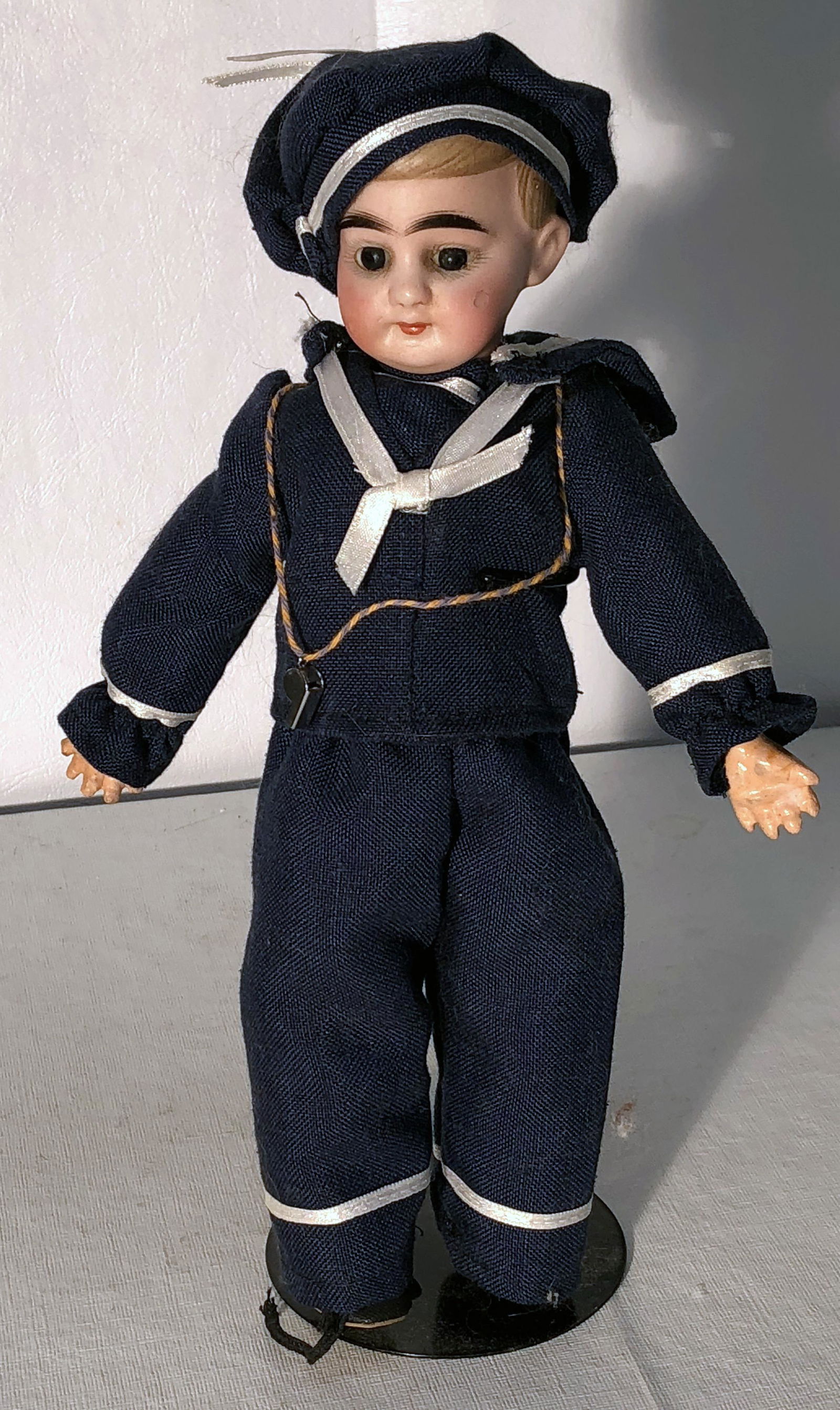 BISQUE HEAD DOLL: 9/0; chip on left cheek; touched up; glass eyes; jointed composition body; chips to fingers and hands; H-9 1/2", F-G