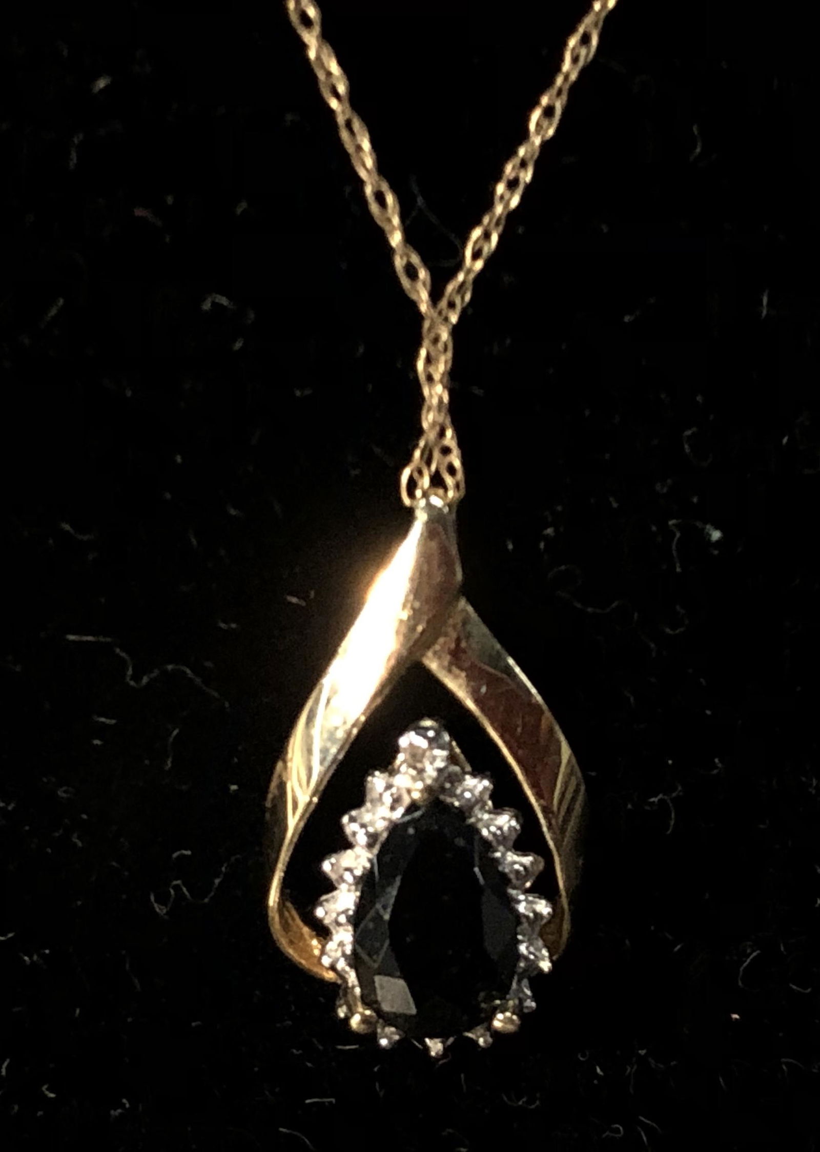 AMETHYST & DIAMOND DROP WITH CHAIN: 14K yellow gold drop and chain, openwork drop 1 1/2 carat +/- teardrop shaped blue stone with tiny diamond at point, H-3/4"; together with 20" fine link chain; 1.9 dwt total