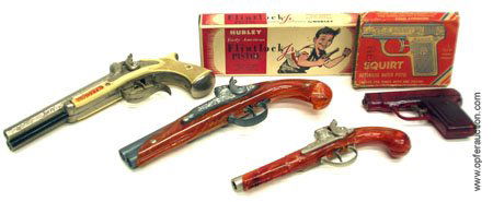 4 FLINTLOCK CAP PISTOLS: HUBLEY, ETC.: LOT OF (4) FLINTLOCK CAP PISTOLS - (1) Pirate: cast metal and plastic; (1) Hubley Flintlock Jr., original box; (1) Hubley Flintlock, broken handle; (1) Squirt, automatic water pistol, original box tor