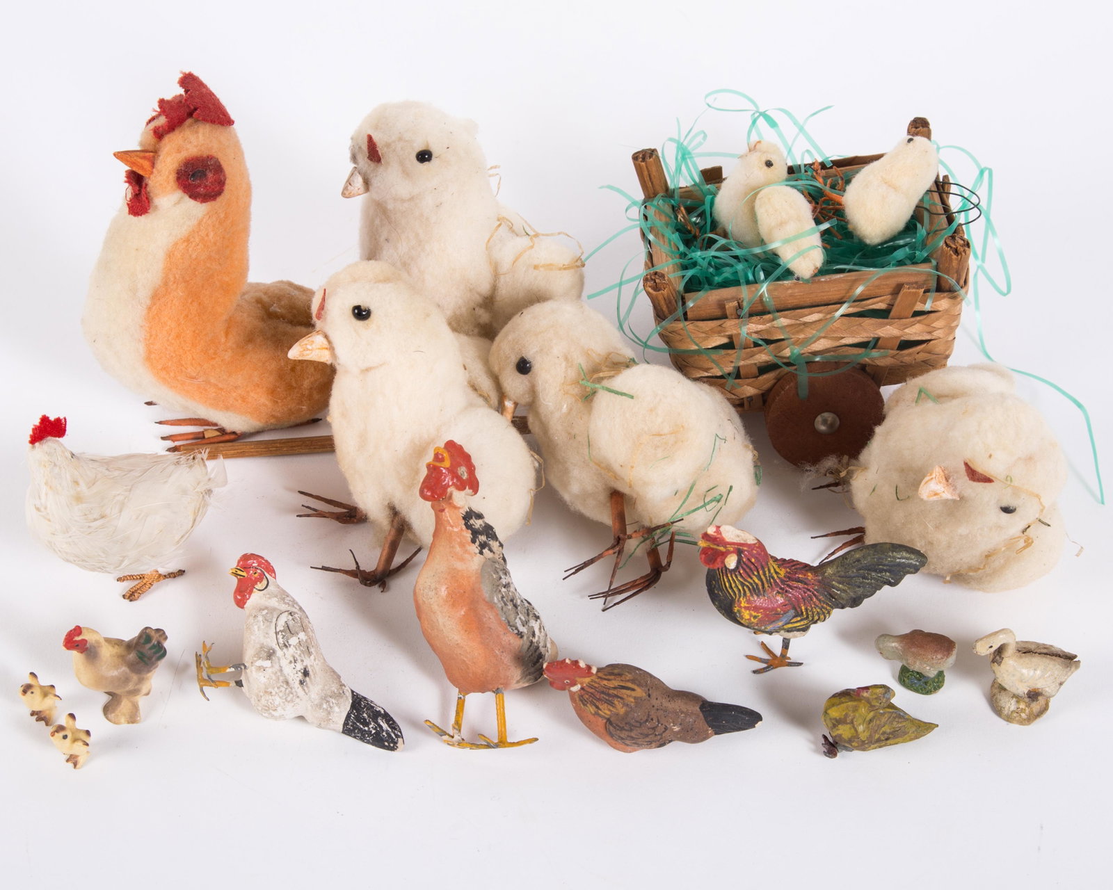 VINTAGE EASTER CHICKS, ROOSTERS & HENS (19+/-): (8) cotton batting; (1) feather covered; (10) painted composition; (1) chicken and hens with original box, Japan; wood and wicker cart missing one pole and one wheel; overall normal wear; some are mis
