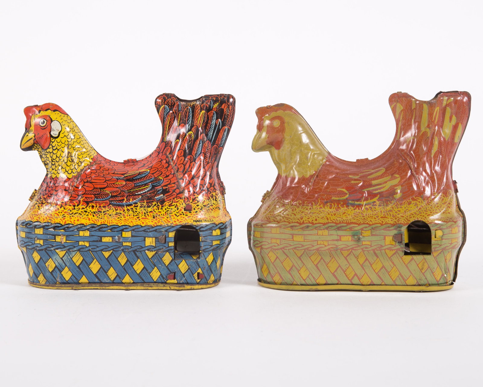 LAYING CHICKEN MECHANICAL TOYS (2): Tin litho; (1) Baldwin Mfg. Co. USA, has one wooden ball; (1) not marked, missing wooden piece on winder; minor scratches, dents and fading; L-5 1/2", G-VG