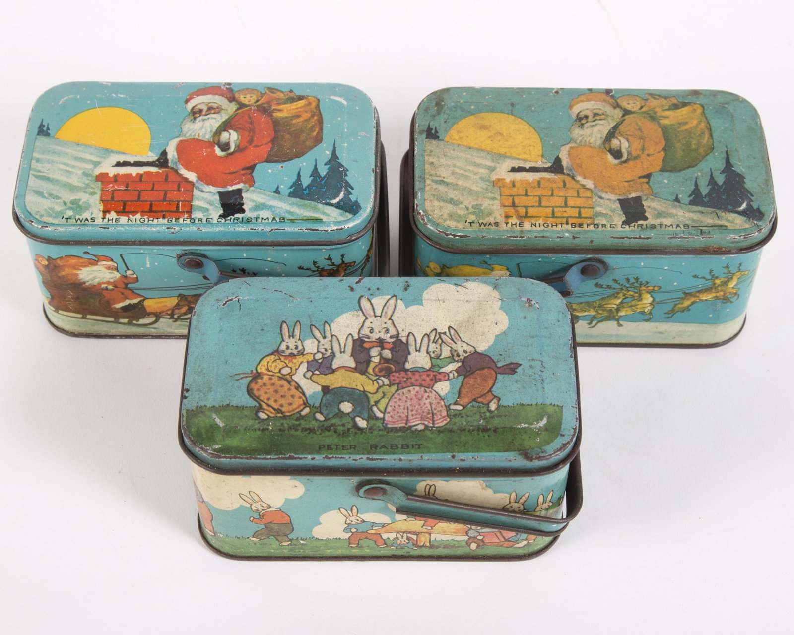 TINDECO CANDY BOXES (3): (2) 'Twas the Night Before Christmas, (1) Peter Rabbit; all stamped "Tindeco" on bottom; minor dents, scratches and scuffs; some fading; L-4 3/4", G-VG