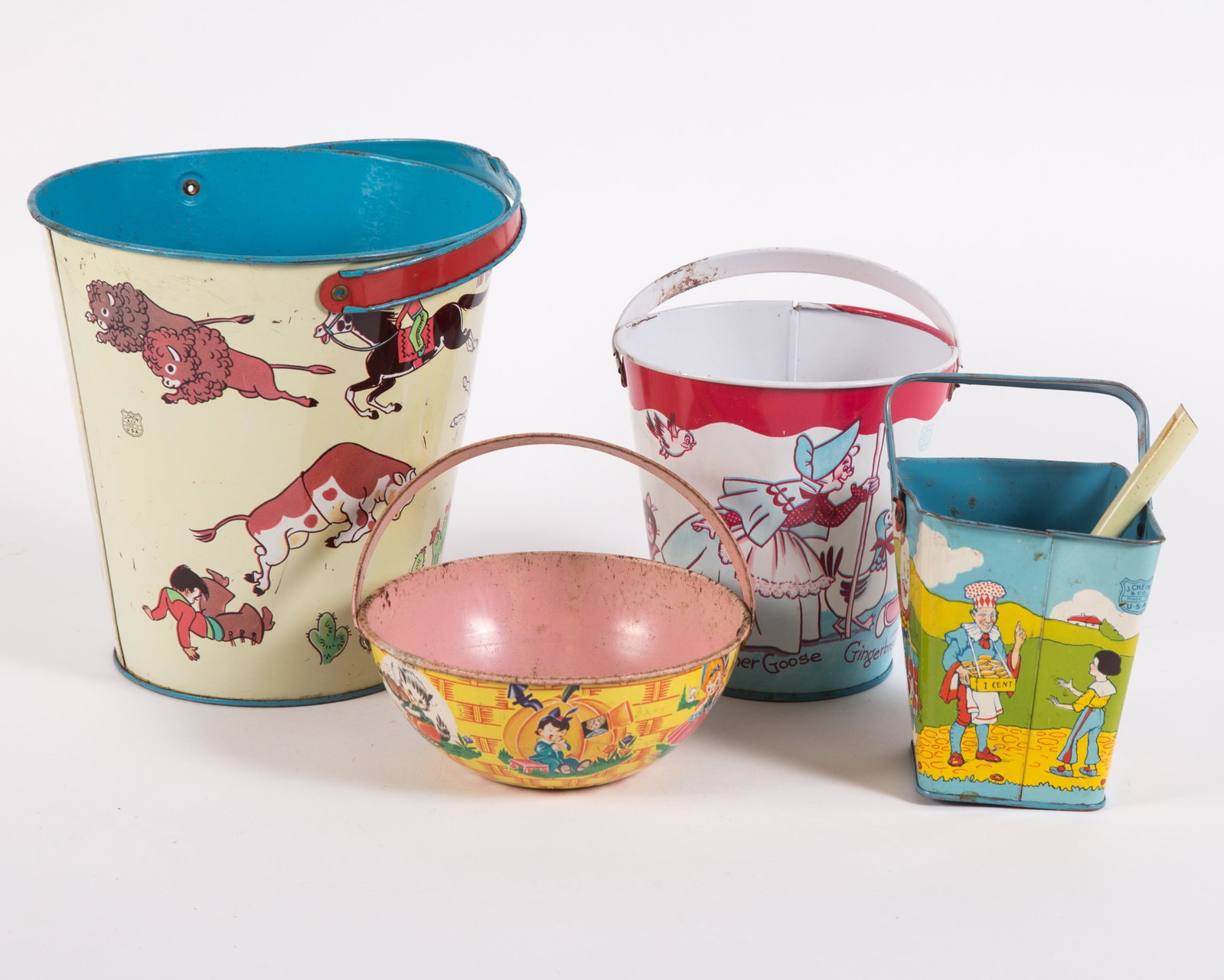 CHEIN, ETC. BUCKETS & SHOVEL (5): Tin litho; (3) Chein buckets: nursery rhymes and Cowboys & Indians; (2) unmarked, Mother Goose and shovel; square bucket is bent and dented; large bucket h as a lot of paint loss on interior bottom; o