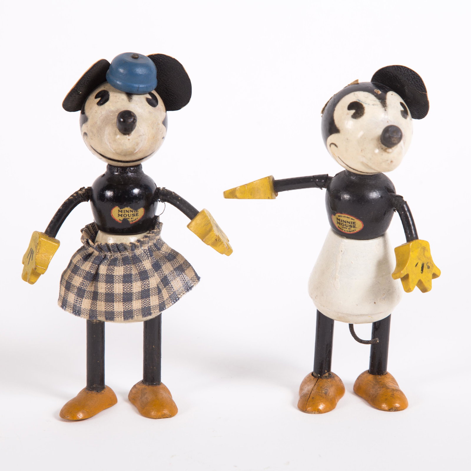 VINTAGE MINNIE & MICKEY DOLLS (2): Painted wood; Mickey's left ear is torn off; Minnie is missing her tail and retains most of her chest decal; arm wear; marks and scuffs; H-5", G-VG