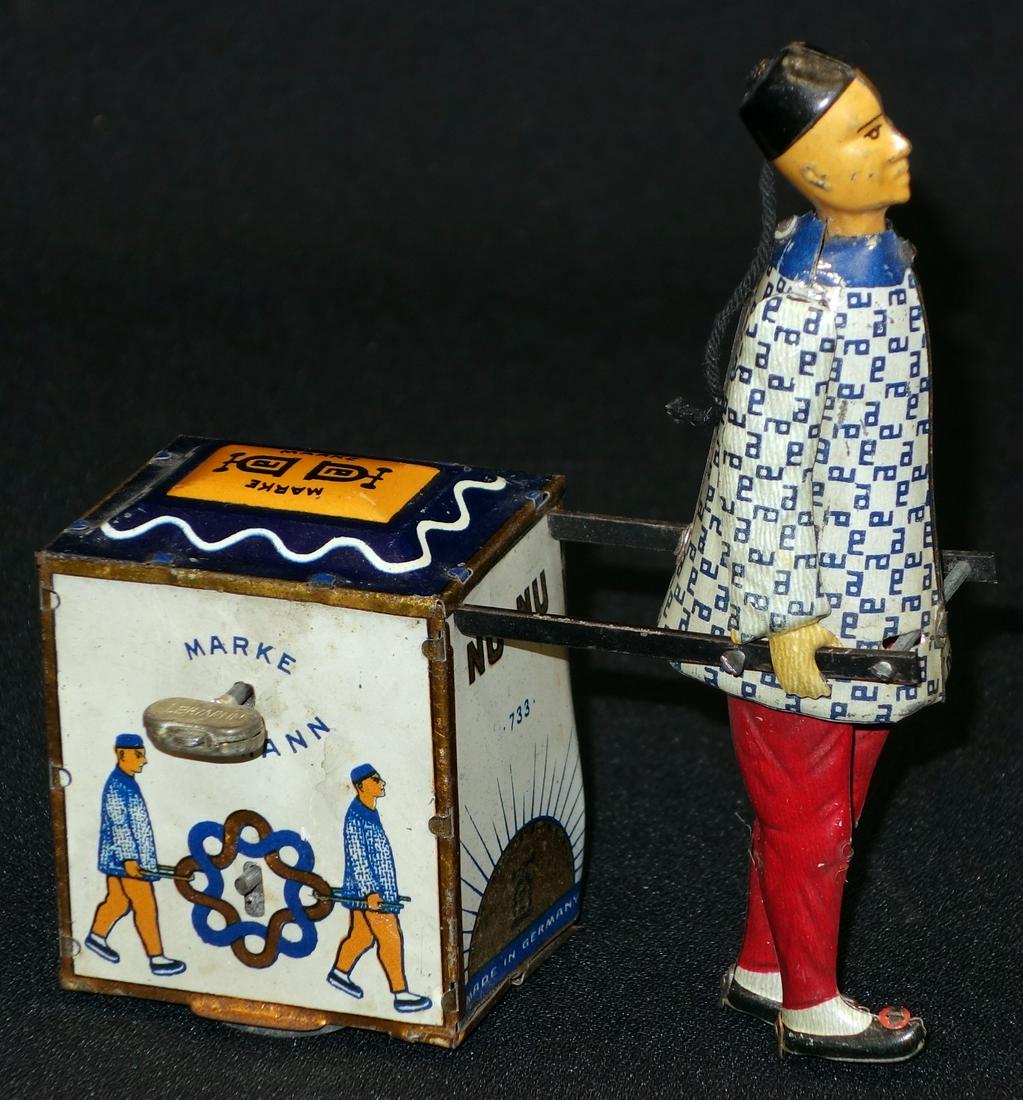 LEHMANN NU-NU WIND-UP TOY: #733; wound tight; dented; paint wear and loss; H-5 1/2", P-F