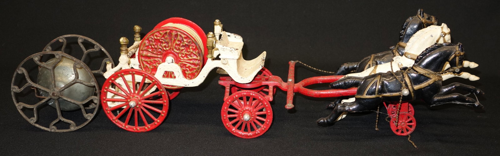 CAST IRON FIRE TOYS (2): Alarm cart and hose; incomplete; paint loss and wear; broken; H-6 1/2", P-G
