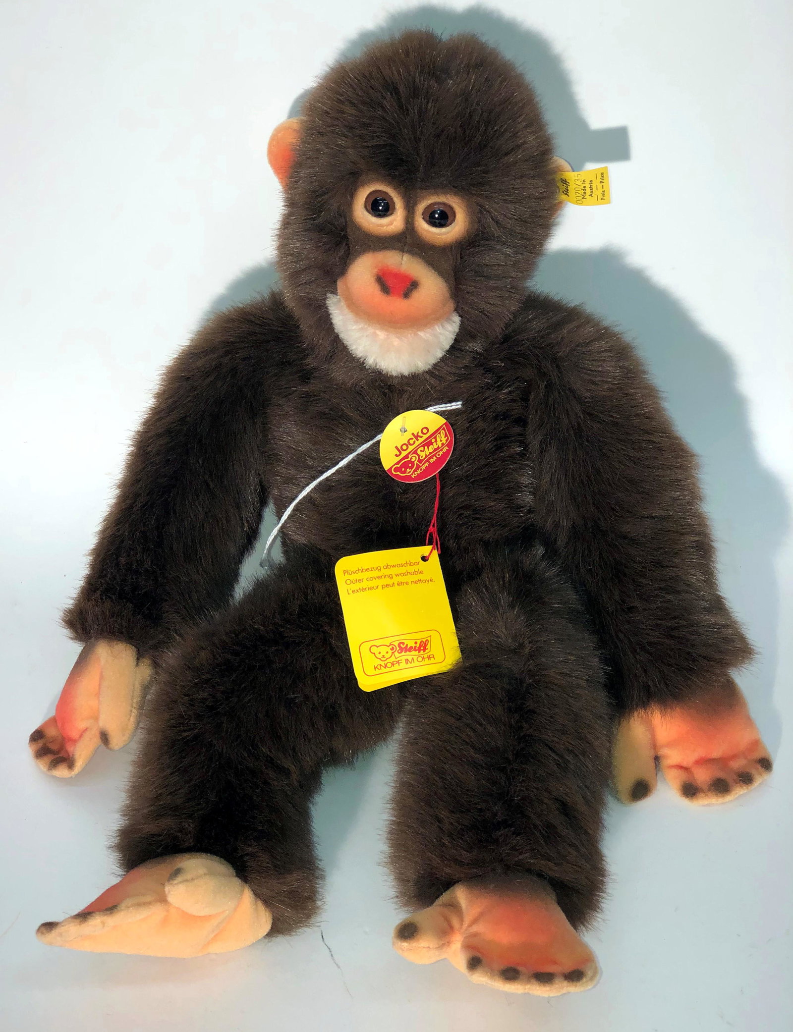 STEIFF MONKEY: "Jocko"; ear button tag and other original tags; floppy body; H-16"; normal wear; G-VG