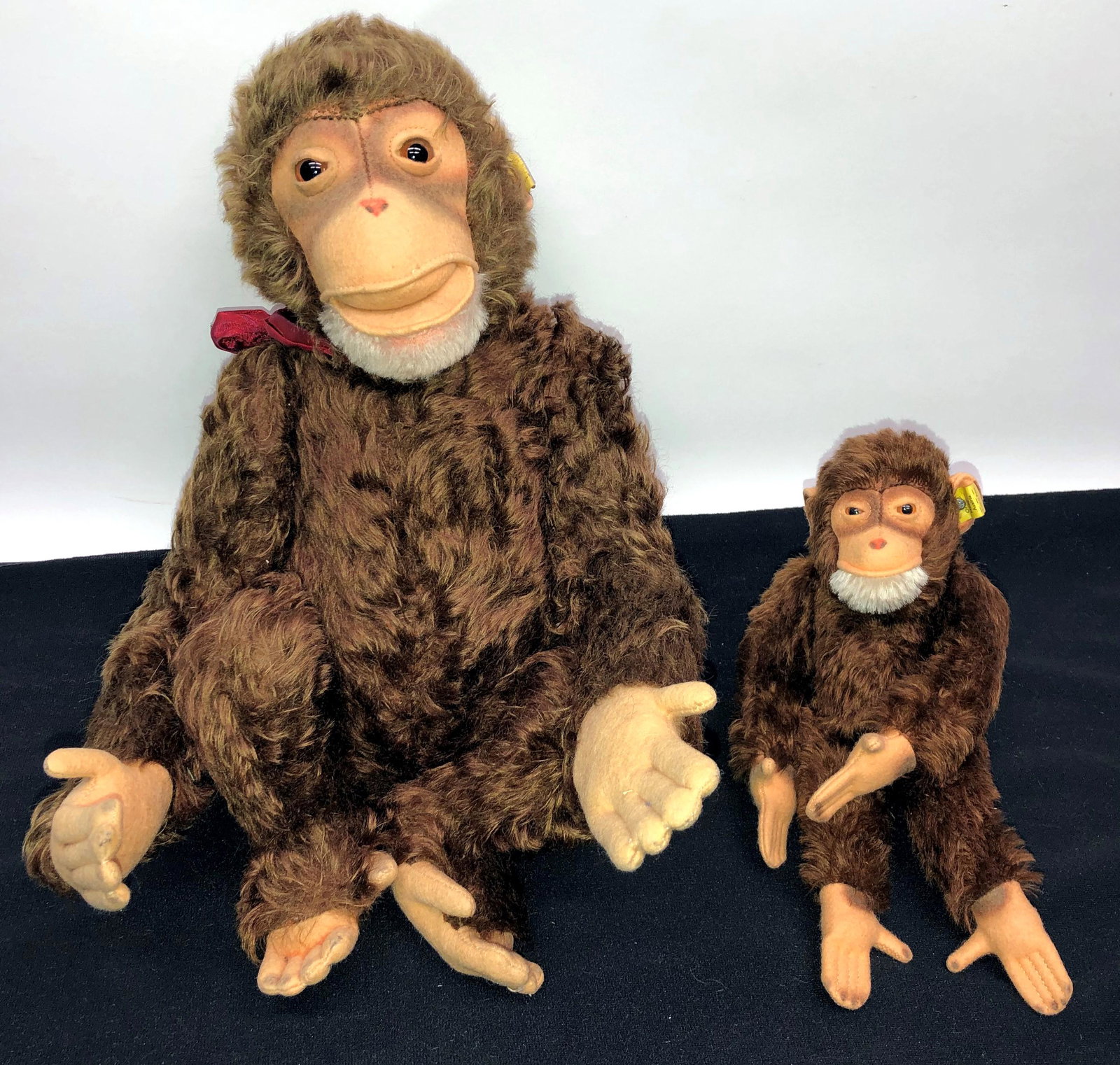 STEIFF MONKEYS (2): Ear buttons and tags; jointed bodies; H-11"-18"; normal wear; G-VG