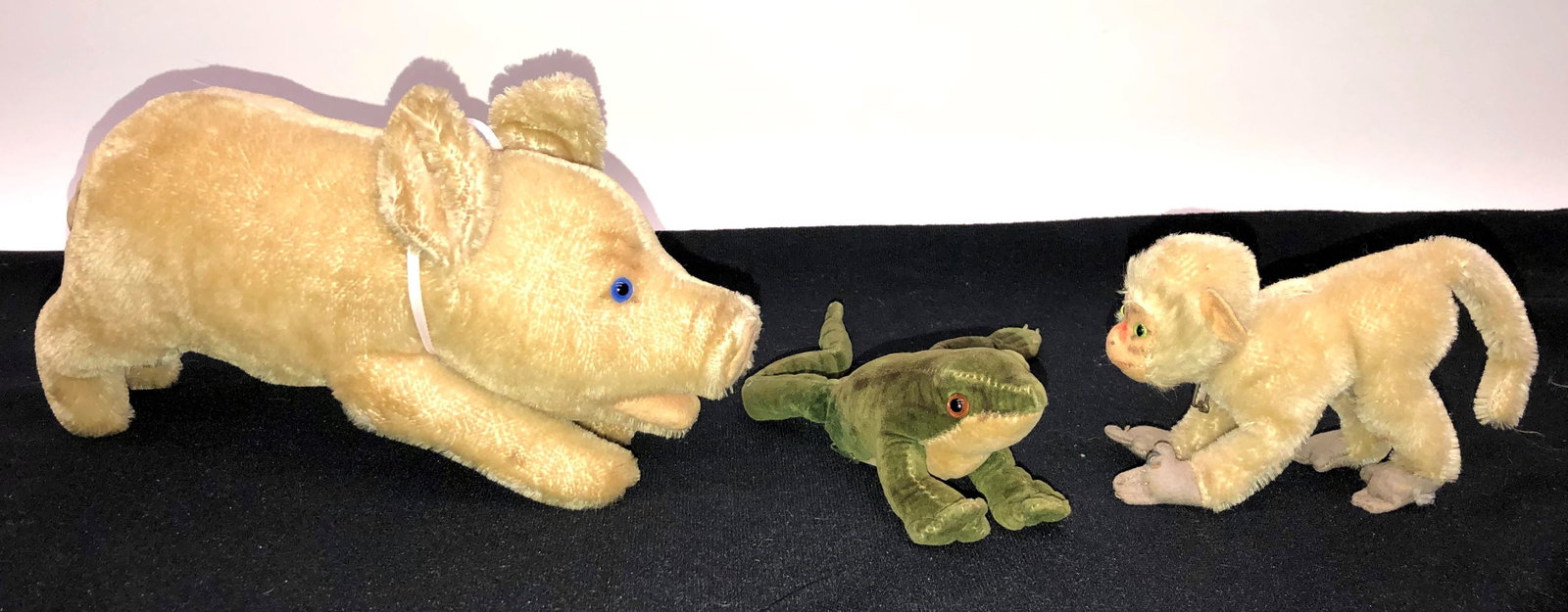 STEIFF ANIMALS (3): (1) pig with ear button; (1) frog; (1) baboon; all damaged; H-3"-6"; F-G